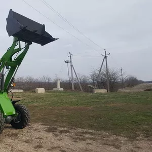 Новый трактор погрузчик для фермы